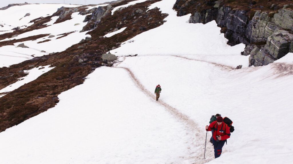 Trekker walking through remote Himalayan valley