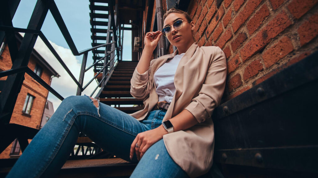 Layered streetwear outfit in city setting